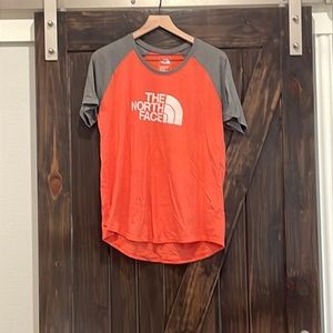 The North Face Womens tee size xl. Orange and gray.